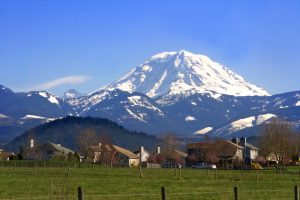 Mt. Rainier viewed from across a field near Buckley, Washington State in the Pacific Northwest part of the United States.